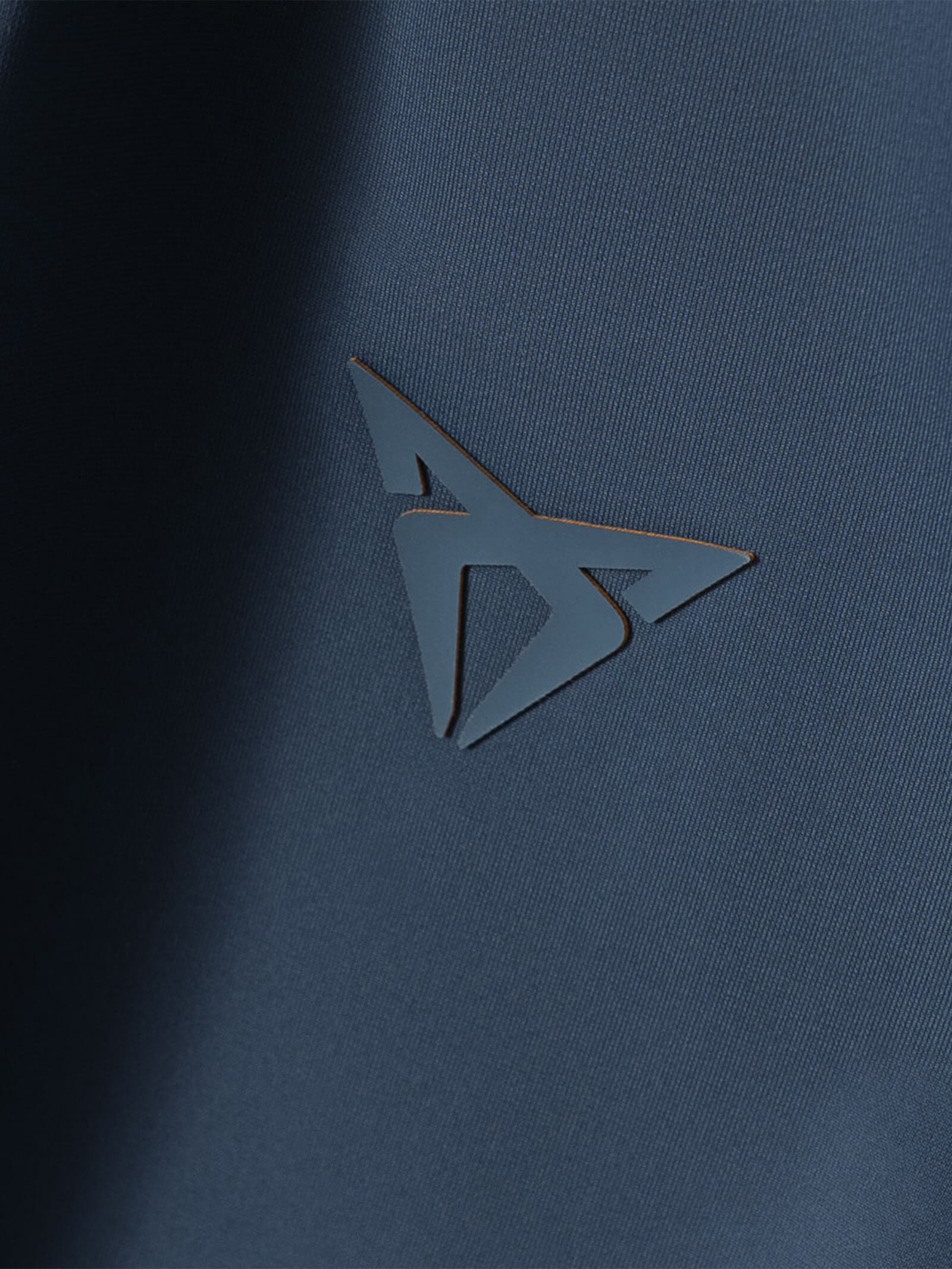 Blue lightweight polo with CUPRA logo tone on tone in silicone.